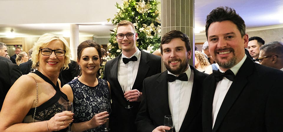 A mix of men and women at the Recognising Excellence event dressed in black tie